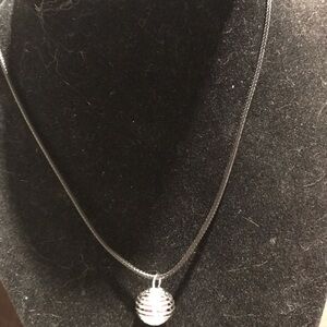 Elegant Silver Cage necklace with amethyst crystal